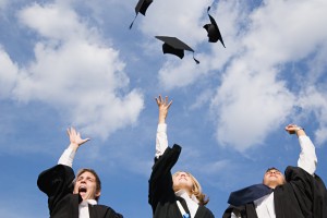 Graduates throwing their mortarboards in the air!